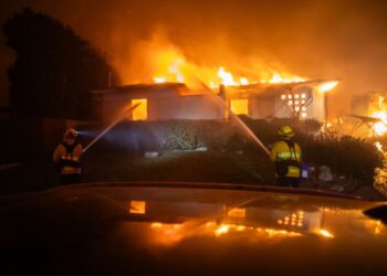 Raging wildfires force flight cancellations and closings of Los Angeles attractions