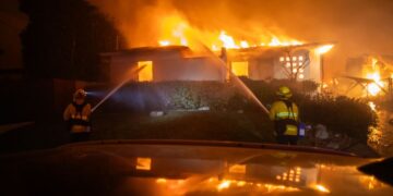 Raging wildfires force flight cancellations and closings of Los Angeles attractions